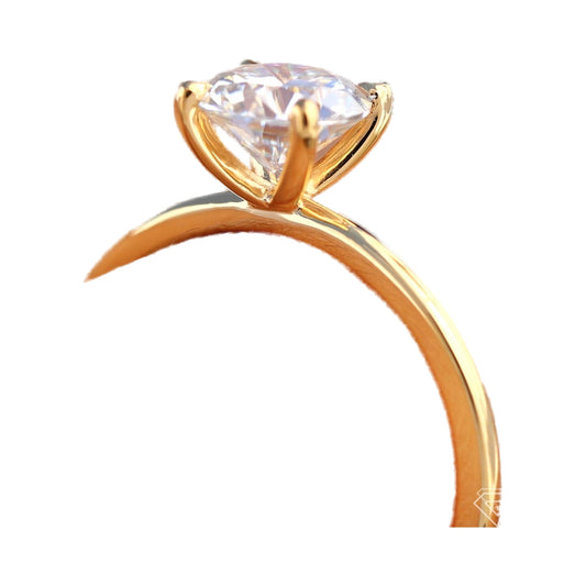 Classic 4-Prong Whisper Thin Round Moissanite Solitaire Ring from Carat and Kraft, on white