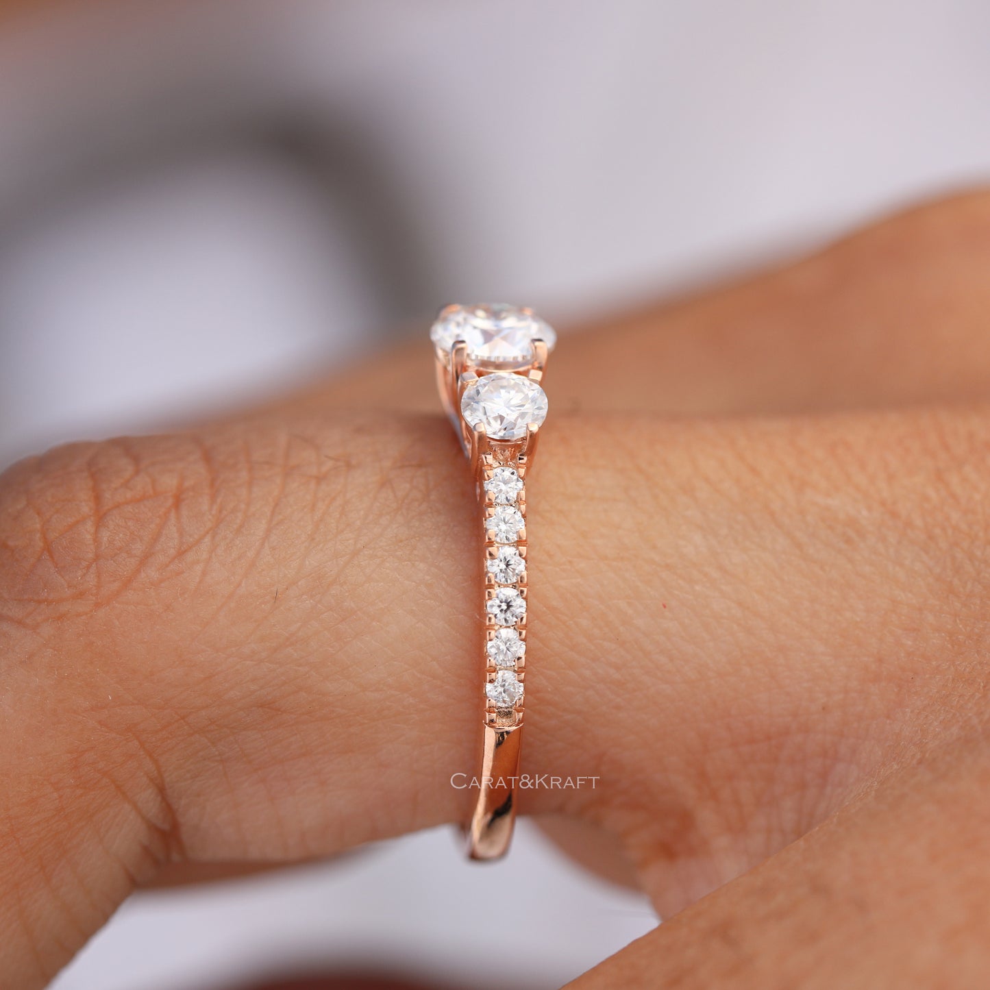 Round Cut Three Stone Side Accent Engagement Ring