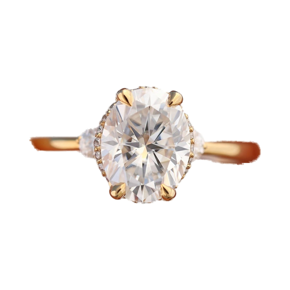9x7mm Oval Moissanite Hidden Halo Three Stone Ring from Carat and Kraft, on white
