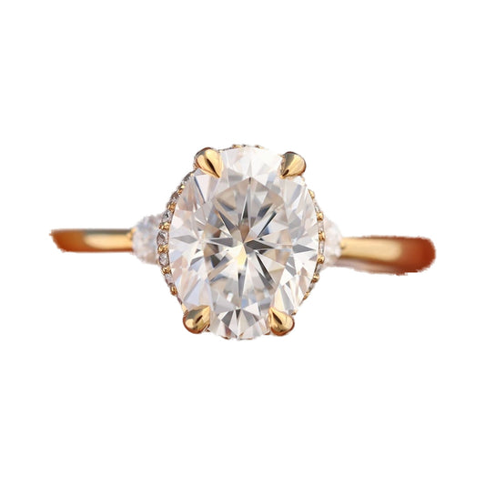 9x7mm Oval Moissanite Hidden Halo Three Stone Ring from Carat and Kraft, on white
