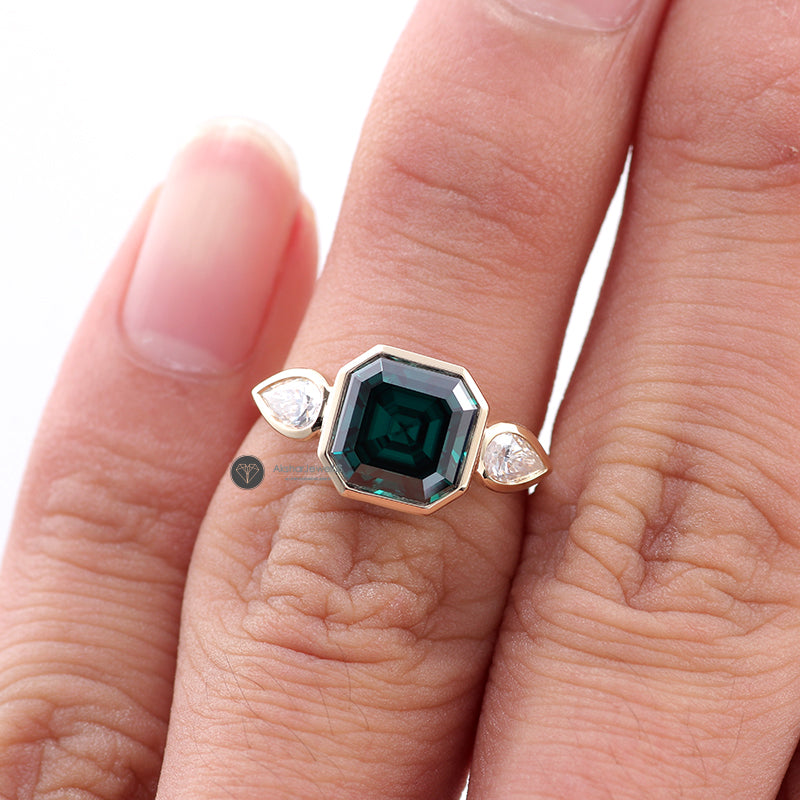 Green Emerald Asscher Moissanite Bezel Set and Pear Three Stone Ring