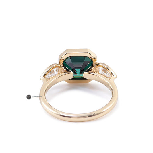 Green Emerald Asscher Moissanite Bezel Set and Pear Three Stone Ring, view 1