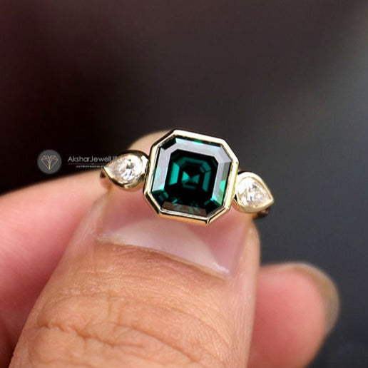 Green Emerald Asscher Moissanite Bezel Set and Pear Three Stone Engagement Ring