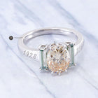 Champagne Oval & Light Green Emerald Three Stone Moissanite Ring