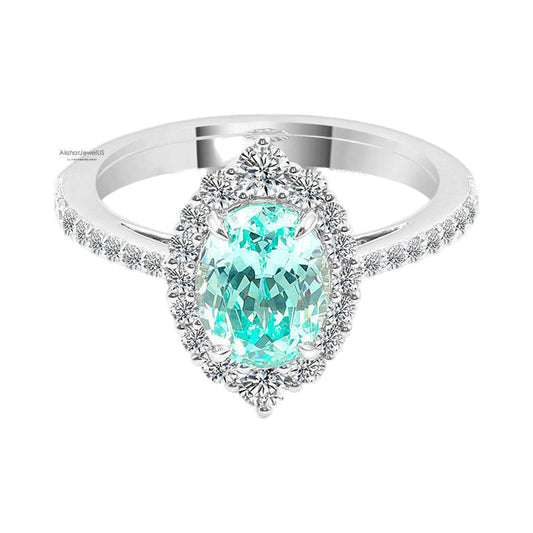 Blue Green Oval Moissanite Halo Ring, Oval Engagement Ring, Split Shank Ring from Carat and Kraft, on white