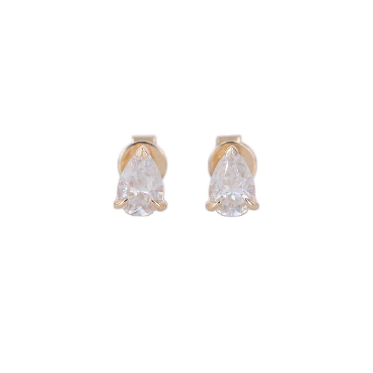 Pear cut lab grown diamond stud earrings in yellow gold