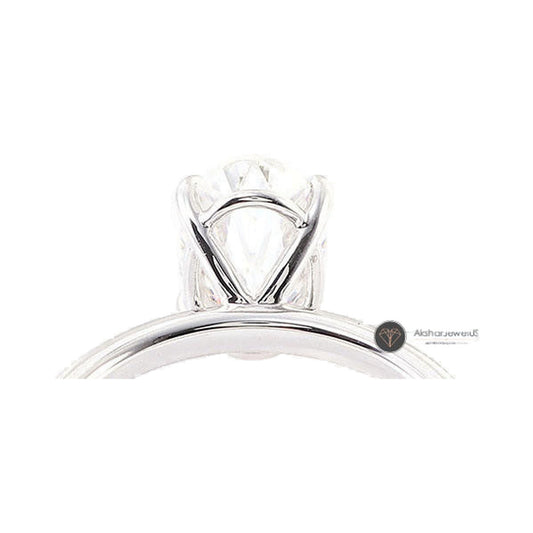 Elongated Crushed Ice Oval Cut Moissanite Solitaire Engagement Ring from Carat and Kraft, on white