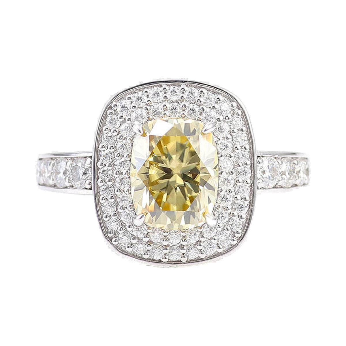 Elongated Yellow Cushion Cut Double Halo Engagement Ring from Carat and Kraft, on white