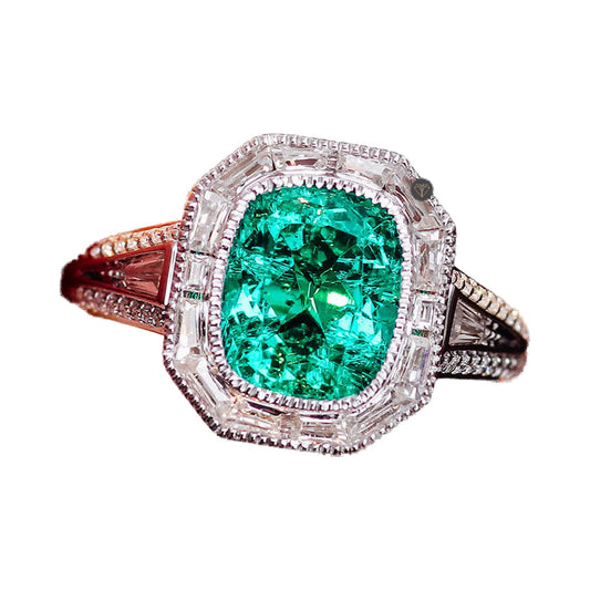 Green Elongated Cushion Cut Milgrain Style Bezel Set Halo Ring from Carat and Kraft, on white