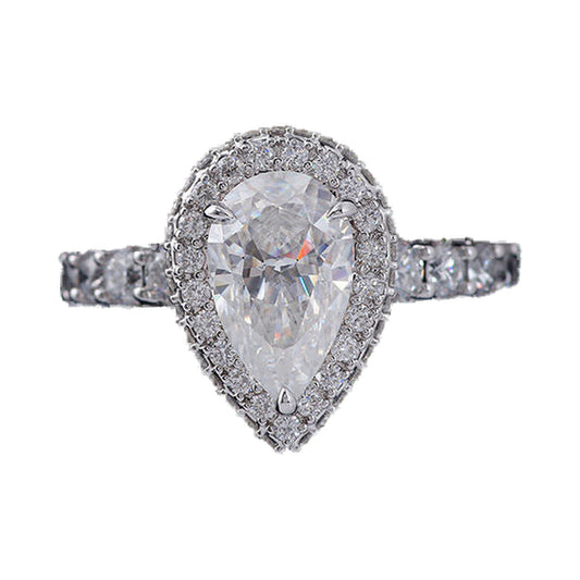 Elongated Pear Halo Moissanite Ring, Hidden Halo Wedding Ring from Carat and Kraft, on white