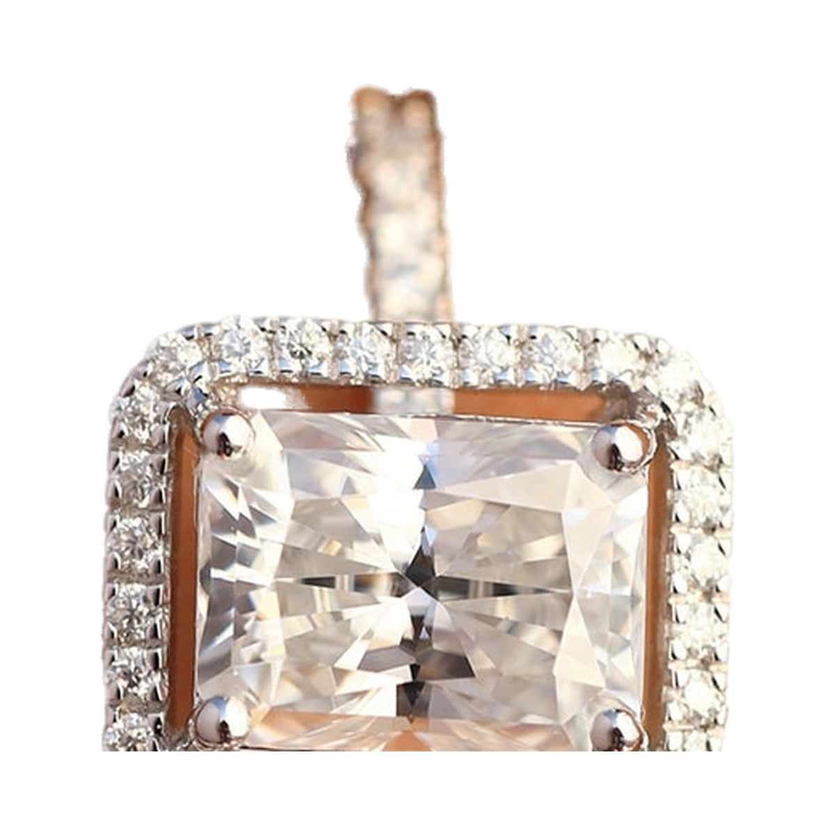 Radiant Cut Distance Halo Moissanite Engagement Ring from Carat and Kraft, on white
