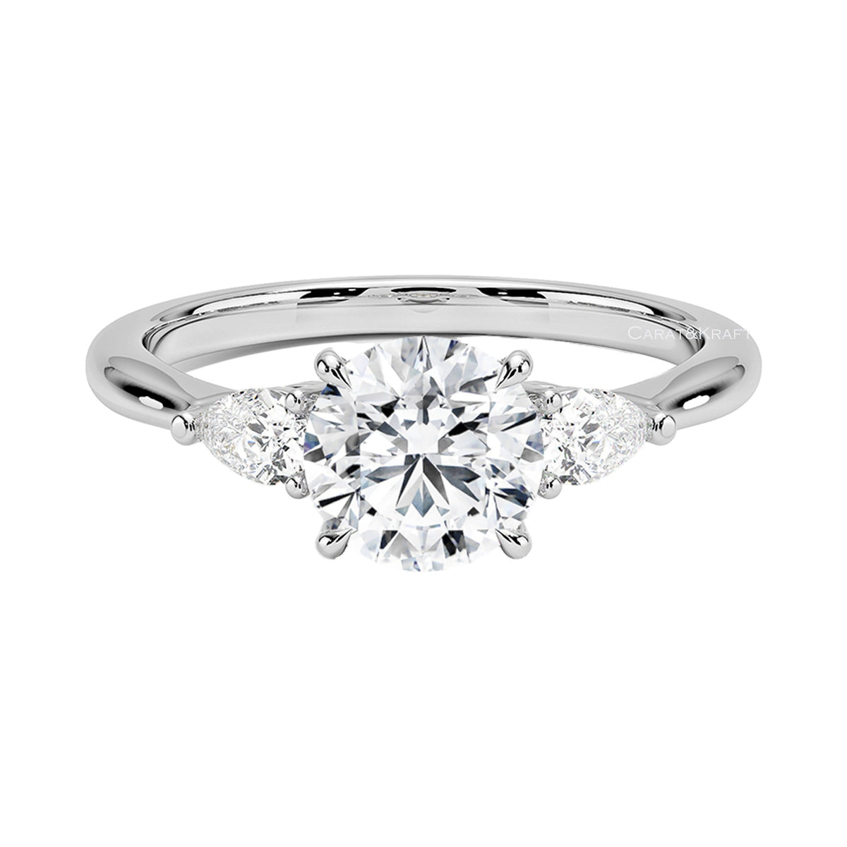 Round Cut Moissanite Diamond Three Stone Engagement Ring from Carat and Kraft, on white