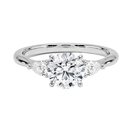 Round Cut Moissanite Diamond Three Stone Engagement Ring from Carat and Kraft, on white