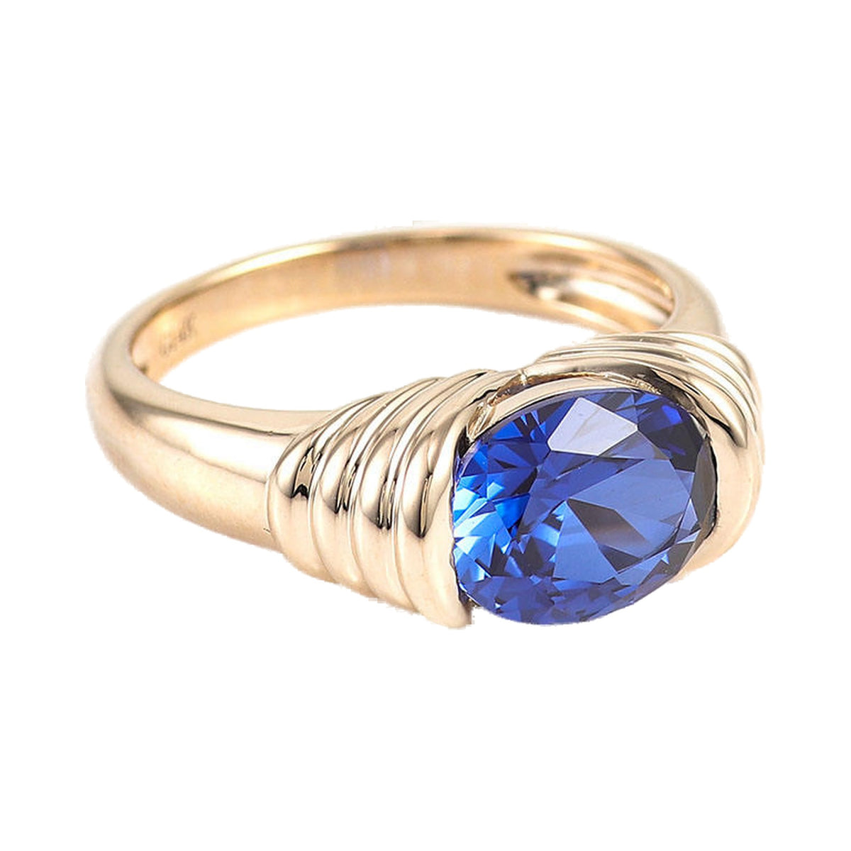 Vintage Style Blue Cushion Cut Sapphire Elongated East West Solitaire Ring from Carat and Kraft, on white